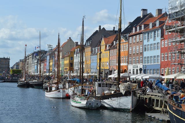 Colorful townhouses and moored boats along Copenhagen's Nyhavn harbour